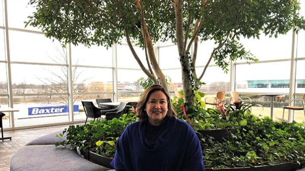 Veronica sits inside the cafeteria at Baxter headquarters