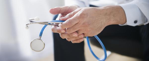 Doctor holding a stethoscope Doctor holding a stethoscope